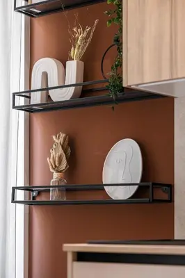 a shelf with plates and dishes in a kitchen at 5 BEAUMONT - Magnifique 3P au style boheme - Quartier Garibaldi in Nice