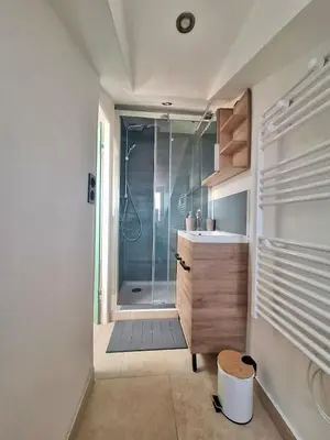a bathroom with a shower and a sink at Lofty Hideout with 2 bedrooms in Nice