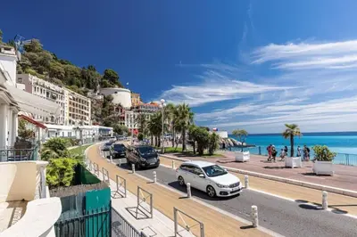 a street in positano with cars parked on the road at Old City Appartement of Nice in Nice