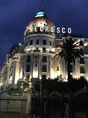 a white building with a sign on top of it at Old City Appartement of Nice in Nice