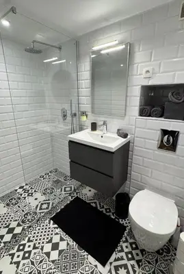 a white bathroom with a sink and a toilet at Old City Appartement of Nice in Nice
