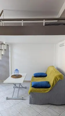 a bed and a table in a room at Appartement - Nice - Quartier du Port in Nice