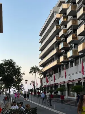 a tall building with people standing in front of it at Studio 4 Carré d'Or in Nice