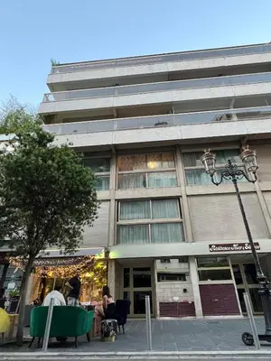 a building with people sitting outside of it at Studio 4 Carré d'Or in Nice