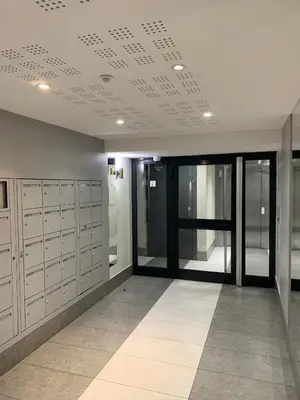 an empty locker room with glass doors and a ceiling at Joli studio, quartier du port in Nice