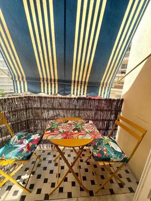a table and two chairs on a balcony at Appartement Rex in Nice