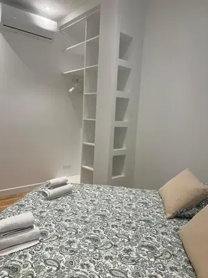 a bedroom with a bed with two towels on it at Appartement Rex in Nice