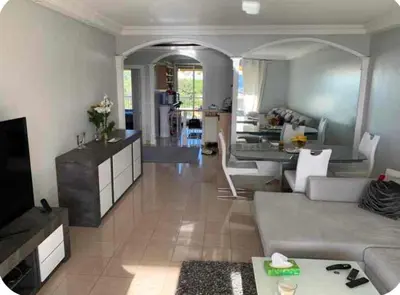 a living room with a couch and a table at Elegant apartment a Nice, Sea View in Nice