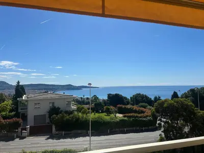 a view of the ocean from a house at Elegant apartment a Nice, Sea View in Nice