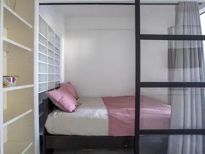 a bedroom with a bunk bed with pink pillows at Apartment Le Persépolis by Interhome in Cagnes-sur-Mer