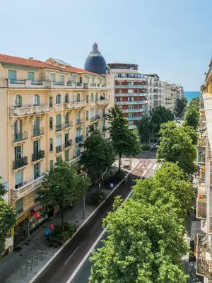 an empty street in a city with buildings at Magnifique studio boulevard gambetta - A in Nice