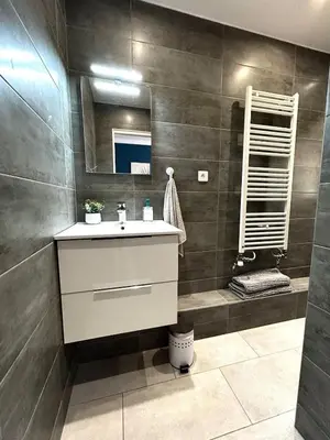 a bathroom with a sink and a mirror at Rêve Bleu de Nice - Terrace - Beach & Tram 5 min in Nice
