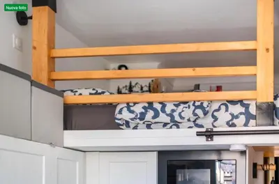 a kitchen with white and blue vases on a shelf at The cozy corner of Amelie in Nice
