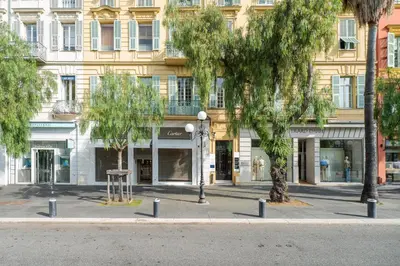 a street with trees in front of a building at Nice Renting - VERDUN - Designer Cocoon Massena Calm Air Conditioning in Nice