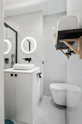 a white bathroom with a sink and a toilet at Nice Renting - VERDUN - Designer Cocoon Massena Calm Air Conditioning in Nice