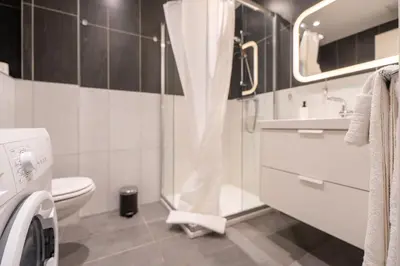 a bathroom with a shower and a toilet and a sink at La Vague Douce in Nice