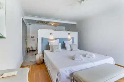 a bedroom with two beds with white sheets and pillows at EDEN VIEW AP4469 by Riviera Holiday Homes in Villefranche-sur-Mer