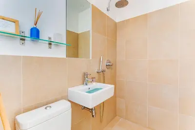 a bathroom with a sink and a toilet at EDEN VIEW AP4469 by Riviera Holiday Homes in Villefranche-sur-Mer