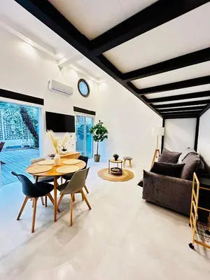 a living room with a table and a couch at Appartement LOFT in Nice