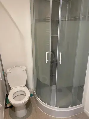 a bathroom with a toilet and a glass shower at Studio Vieux Nice in Nice