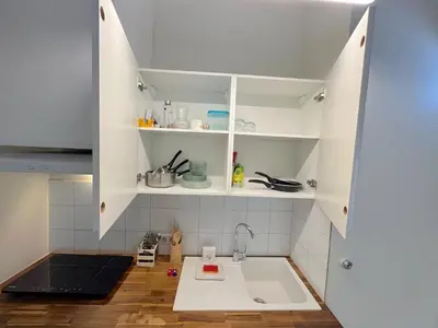 a kitchen with white cabinets and a sink at ⁂ Charmant Mezzanine Central - Clim Wifi Famille in Nice