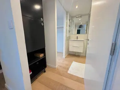 a small bathroom with a sink and a black wall at ⁂ Charmant Mezzanine Central - Clim Wifi Famille in Nice