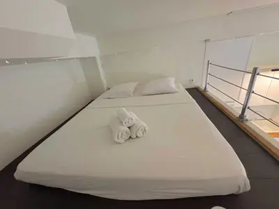 two towels on two beds in a room at ⁂ Charmant Mezzanine Central - Clim Wifi Famille in Nice
