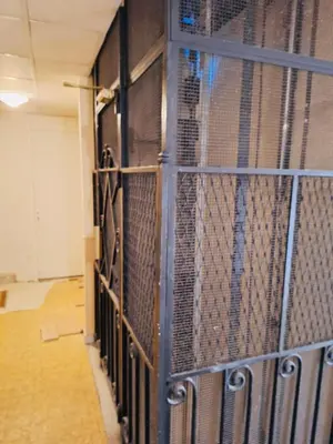 a prison cell with a metal fence at Coin d'Amour Gambetta in Nice