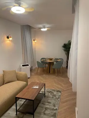 a living room with a couch and a table at Recently renovated apartment in quiet area in heart of Old Nice in Nice