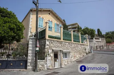 a stone house with a balcony on top of it at Studio in Villefranche in Villefranche-sur-Mer