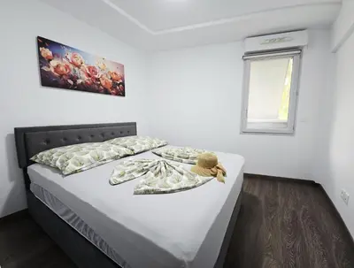 a bedroom with a bed with a teddy bear on it at Nice Riquier 8 in Nice