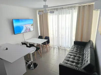 a living room with a couch and a table at Nice Riquier 8 in Nice