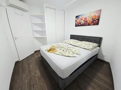 a bedroom with a bed with a hat on it at Nice Riquier 8 in Nice