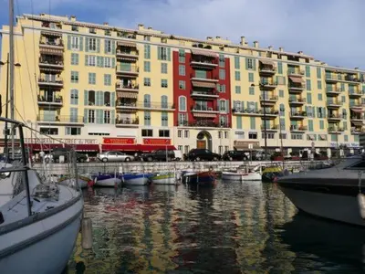 a collage of four pictures of a living room at Port de Nice-charmant appartement bucolique ! vue port in Nice