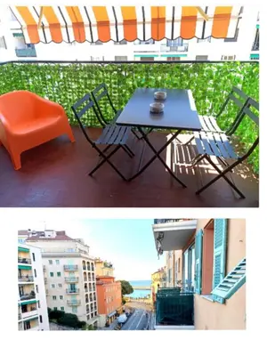 a table and chairs sitting on a balcony at Port de Nice-charmant appartement bucolique ! vue port in Nice