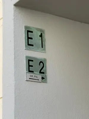 a clock on the side of a wall with the word exit at Port de Nice-charmant appartement bucolique ! vue port in Nice