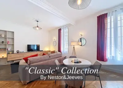 a living room with a couch and a table at Nestor&Jeeves - NISSA - Central location in Nice