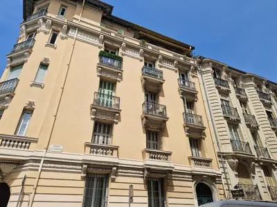 a large building with balconies on a street at Nestor&Jeeves - NISSA - Central location in Nice