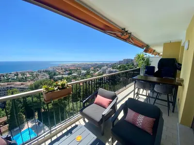 a balcony with chairs and a table and a view at Nice Ouest-Splendide 3p, Roof-Terrace Panoramic Sea View in Nice