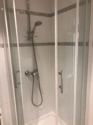 a shower in a bathroom with a glass door at Villefranche in Villefranche-sur-Mer