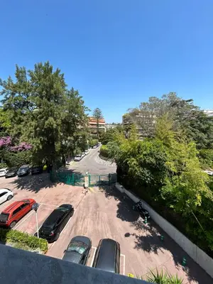 a group of cars parked in a parking lot at Appartement Nice promenade des anglais in Nice