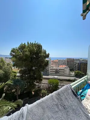 a view of a city from a balcony at Appartement Nice promenade des anglais in Nice