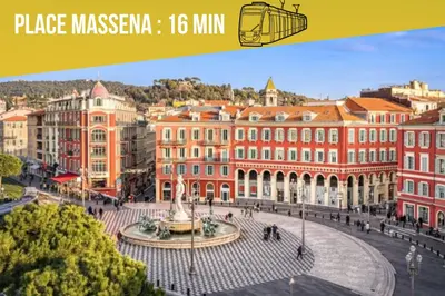 a view of a city with buildings and a fountain at Le Cocon Niçois in Nice