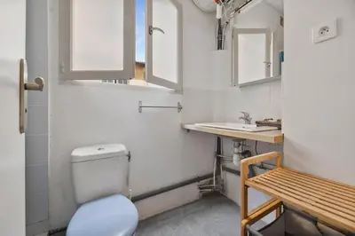 a bathroom with a toilet and a sink at Nice et confortable 2 pièces cozy in Nice