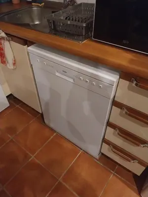 a dishwasher in a kitchen under a counter at Studio Carré d 'Or - 5 minutes de la mer in Nice
