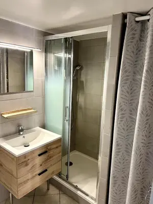 a bathroom with a shower and a sink at Cozy apartement near the beach with with Aircon in Nice