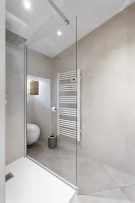 a glass shower in a bathroom with a toilet at Nice Renting - 6B FRANCE - Massena beach design AC quiet center wifi in Nice