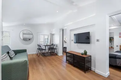 a living room with a couch and a bed at Nice Renting - 6B FRANCE - Massena beach design AC quiet center wifi in Nice