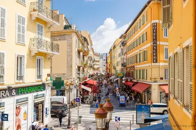a city street with buildings and people walking on the street at Nice Renting - 6B FRANCE - Massena beach design AC quiet center wifi in Nice