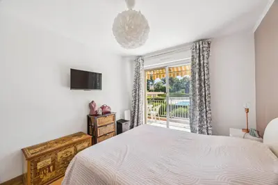 a bedroom with a bed and a window at Happyfew La Suite Nicerama in Nice